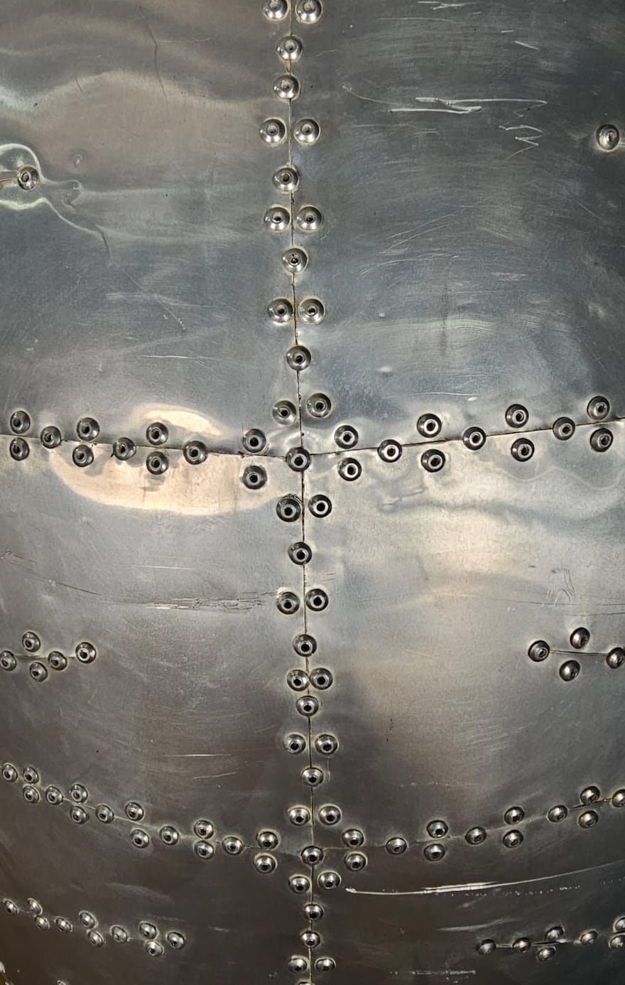 Riveted metal